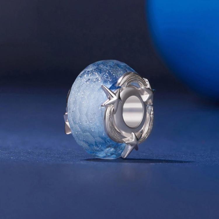 Blue glitter glass bead with silver star cap and oval plated metal frame