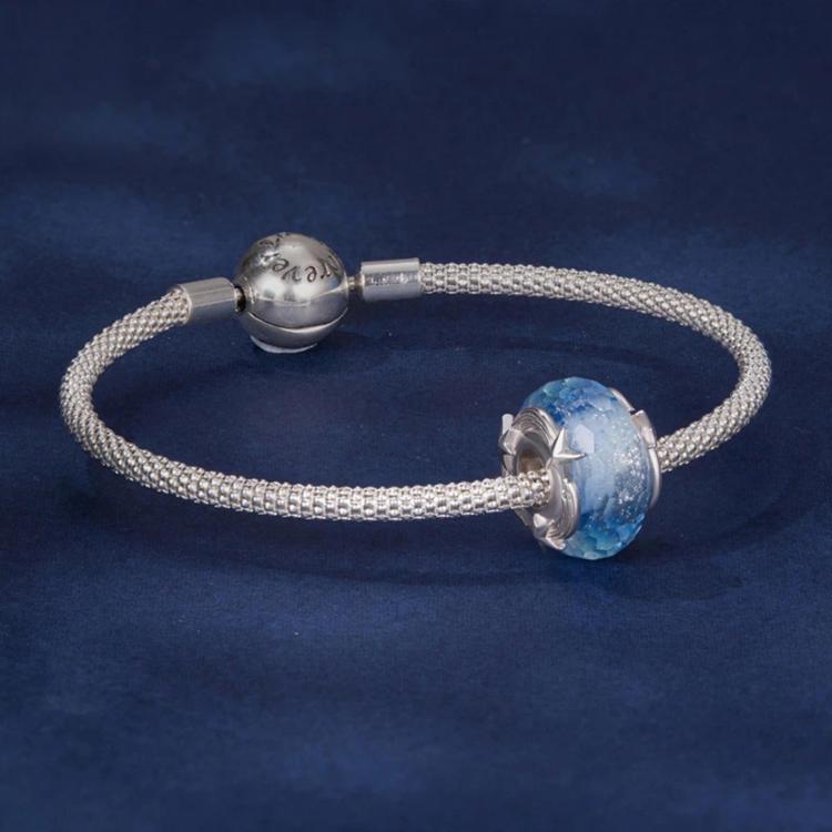 Beaded bracelet with blue glitter glass charm beads and silver metal clasp