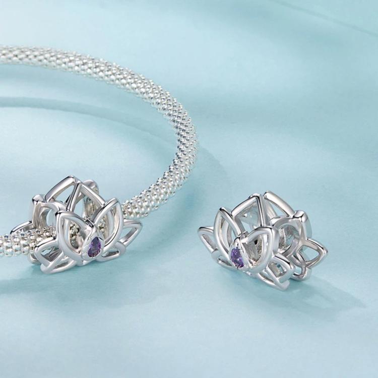Lotus beaded bracelet with silver-toned bead cord and purple oval lotus gem