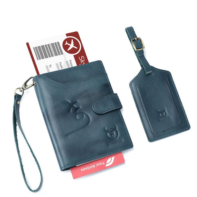 Blue leather passport holder with luggage tag, embossed aircraft emblem, wrist strap