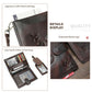 Dark leather passport holder with embossed logo, flap pocket, keychain loop