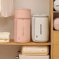 Two compressible quilt storage bags in pink and light gray on a closet shelf