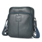 Men's dark blue leather crossbody bag with zip top and front logo patch.