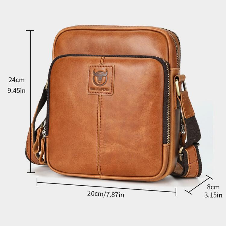 Brown leather crossbody messenger bag, front logo patch, zip closure, side strap loops.