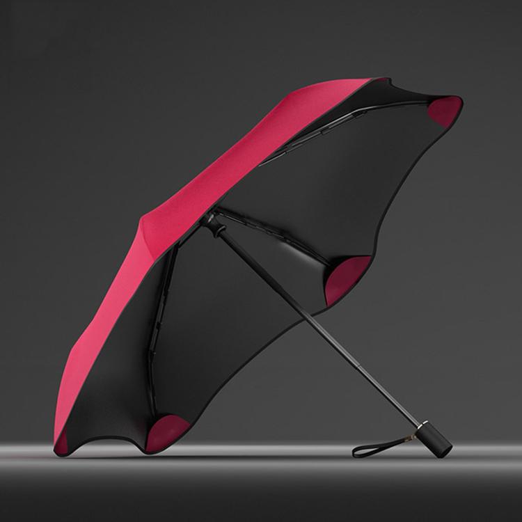 Three-fold manual sun umbrella, red-and-black canopy with curved panels and hand strap
