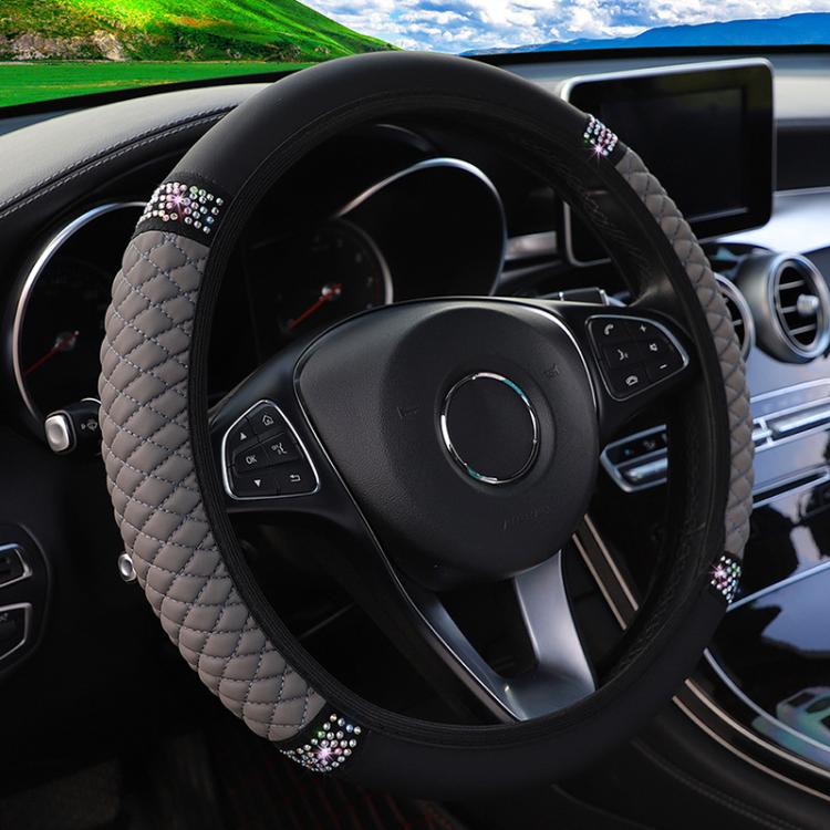 Quilted leather steering wheel cover with rhinestone trim, grey