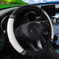 Quilted leather steering wheel cover with rhinestone trim, white