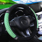 Green quilted steering wheel cover with black edge and rhinestone studded trim