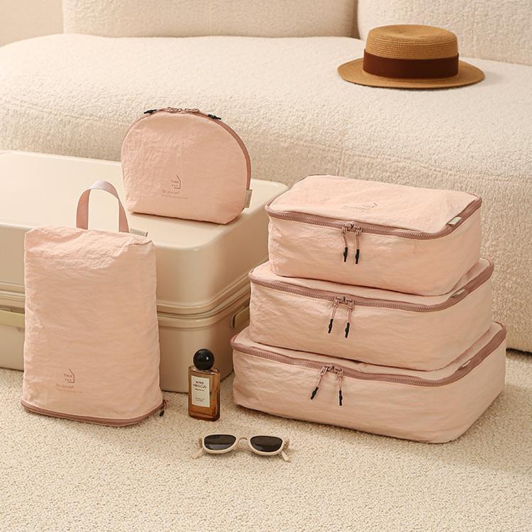 Pink packing cubes set: three stacked zip pouches plus cube organizer bag