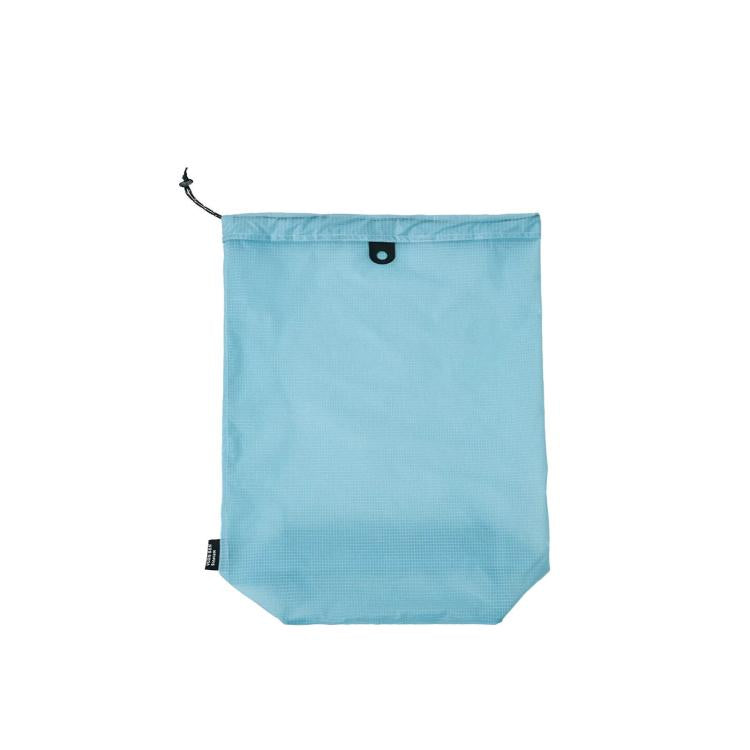 Waterproof drawstring shoe storage pouch in sky blue, front view with grommet tab