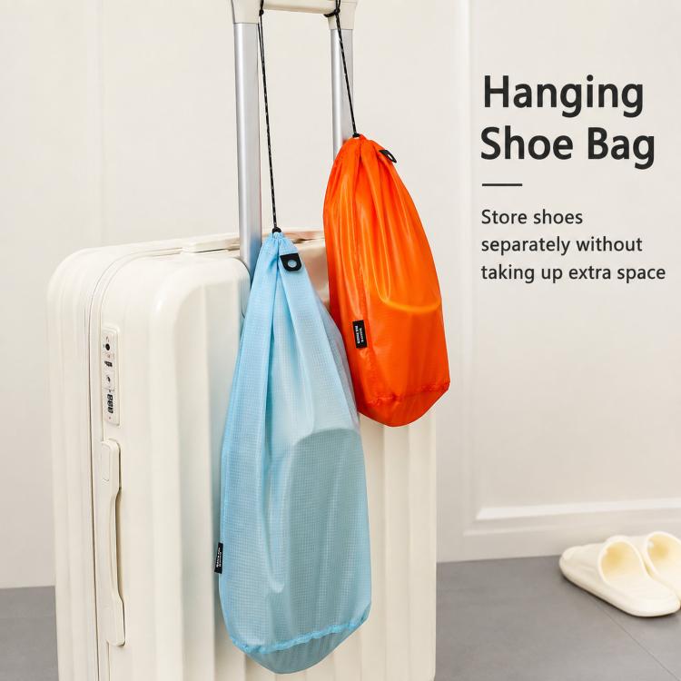Hanging waterproof drawstring shoe storage pouches, light blue and orange on hooks