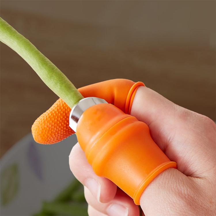 Close-up of orange anti-cut finger sleeve on thumb knife cutter handle