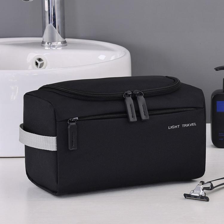 Black zippered travel toiletry bag with two front compartments and carry strap