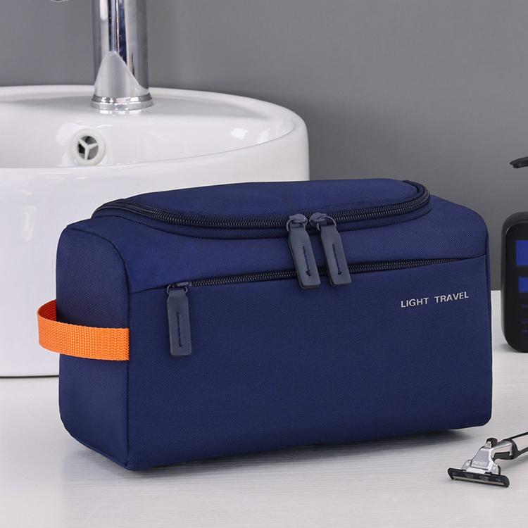 Navy blue zippered toiletry organizer pouch with orange trim and front compartments