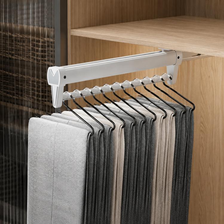 Extendable top-mount closet hanger rail, white bar with black hooks and folded pants/scarves