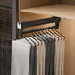 Extendable top-mount closet hanger rail, black bar with black hooks holding pants/scarves