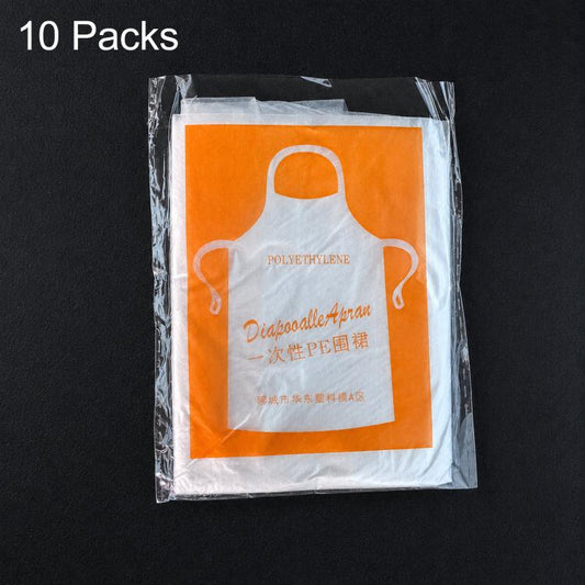 Individually wrapped white polyethylene disposable apron in orange-tinted pouch