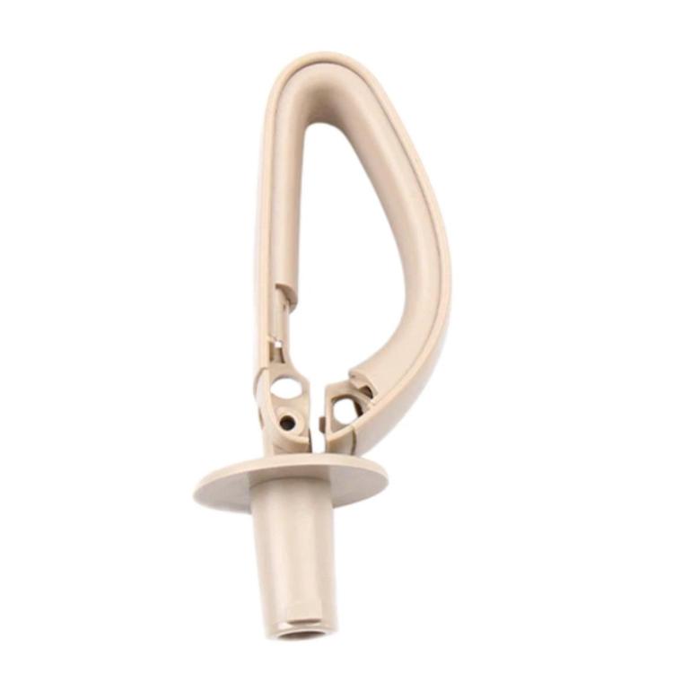 Satinized beige rear seat belt guide device, angled side view with round base.