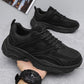 Men's black lace-up sneakers with breathable mesh texture and chunky outsole