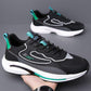 Men's breathable mesh running sneaker, black with teal accents and white sole