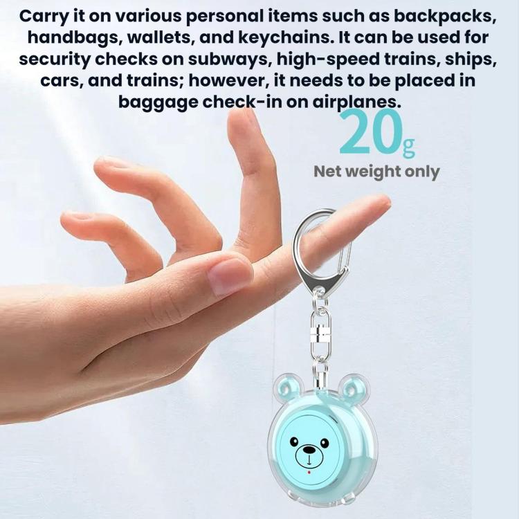 Teal bear-face personal alarm keychain held in a hand with metal ring clip
