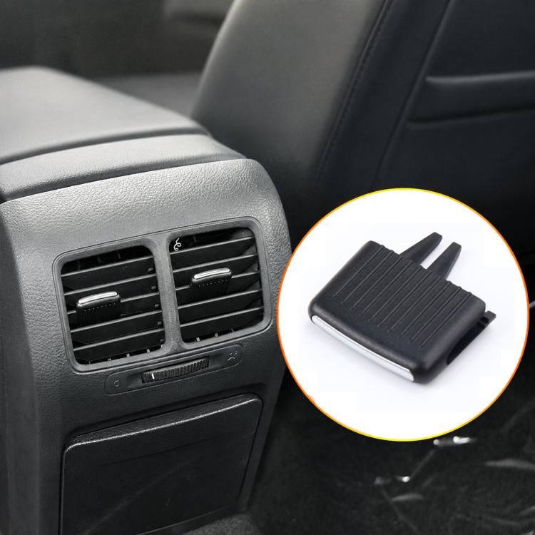 Black car AC vent grille paddle insert with angled ridged face and tabs