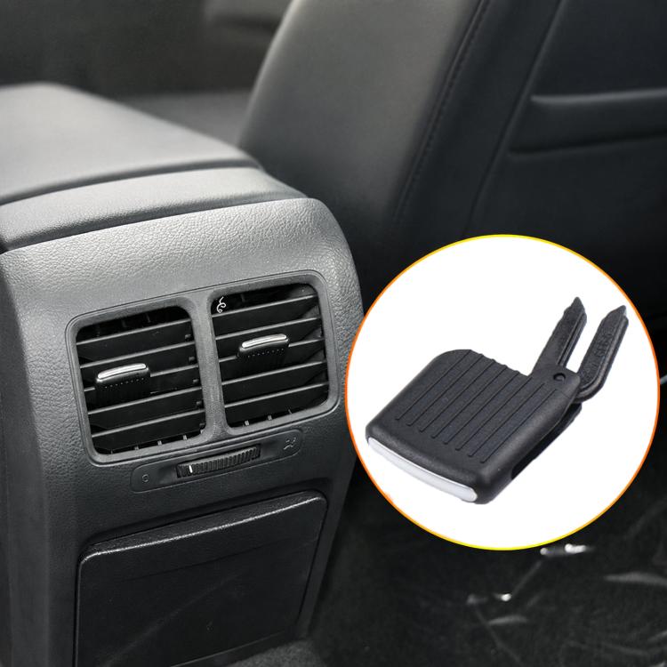Black AC vent grille paddle insert, angled view with two side mounting prongs