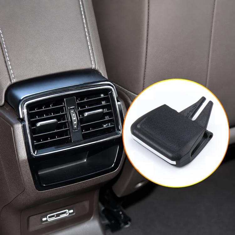 Black air vent grille paddle clip close-up, molded plastic with two prongs