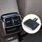 Black air vent grille paddle clip with two prongs, close-up inset detail