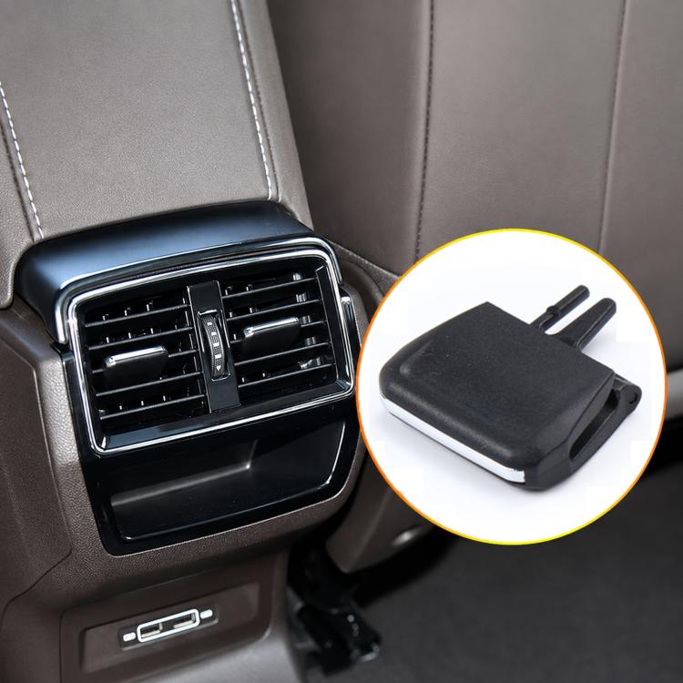 Black air vent grille paddle clip with two prongs, close-up inset detail
