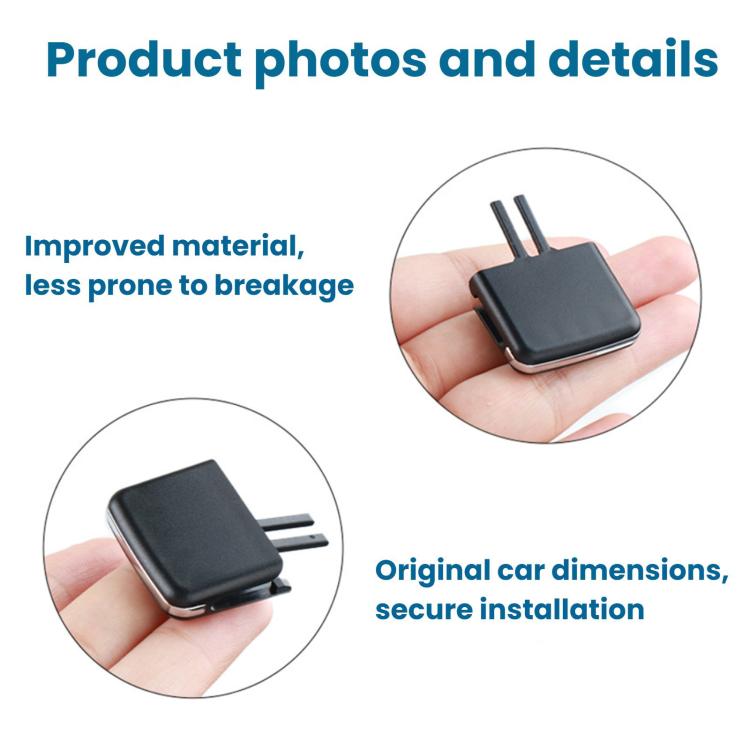 Black air vent direction adjustment paddle held in hand with two mounting prongs