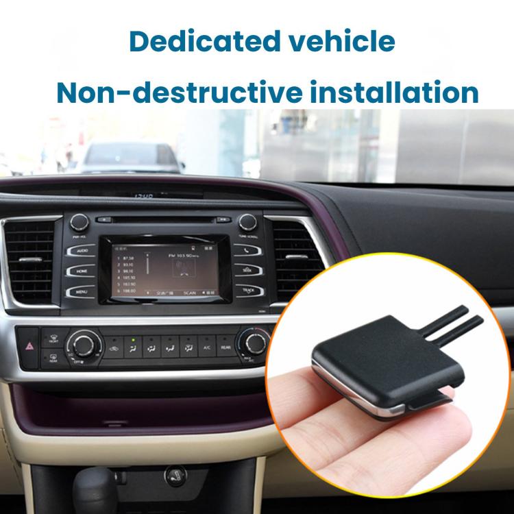 Black air vent direction adjustment paddle held above center dashboard vent area