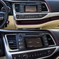 Center dashboard air vent grille and surrounding black control panel