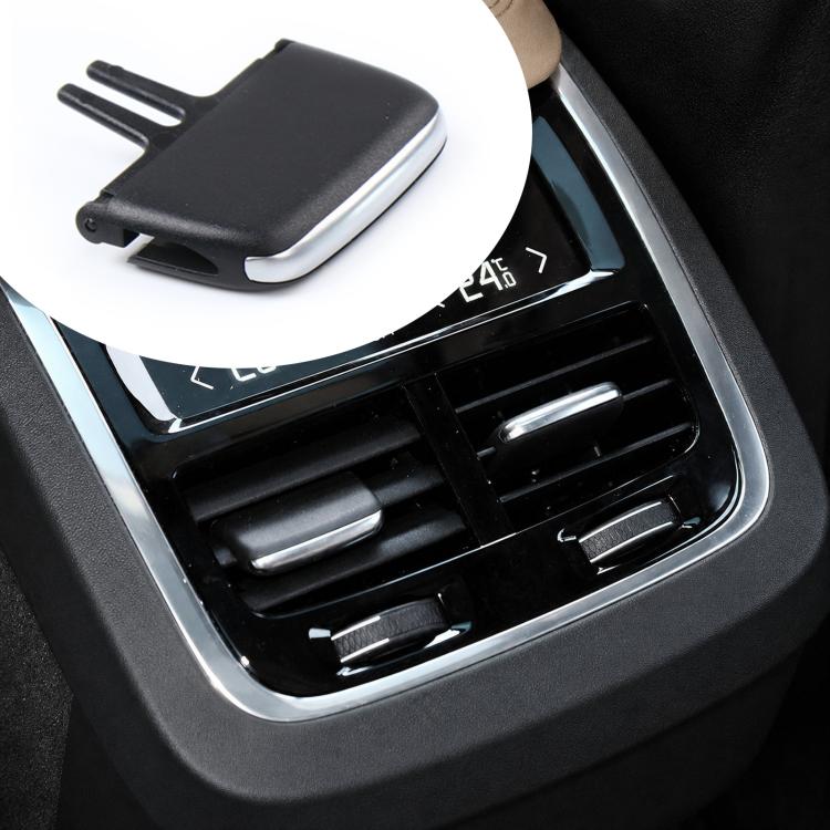Black air vent paddle shifter insert, close-up on center dashboard vent