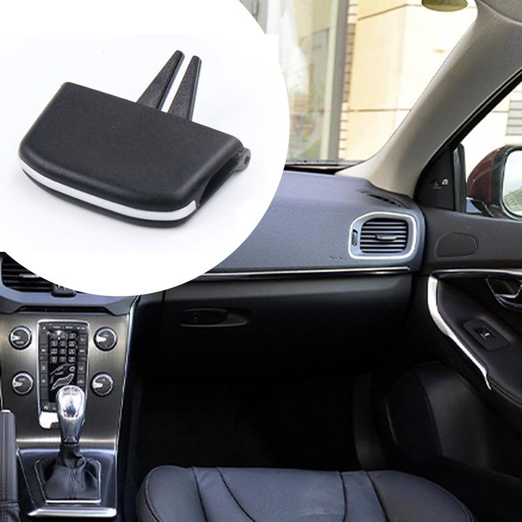 Black air vent paddle slip cover shown installed beside dashboard vent grille