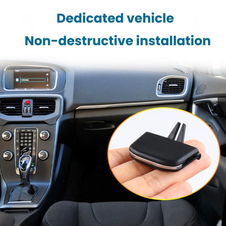 Black vent paddle slip cover held in hand, shown near dashboard center vent