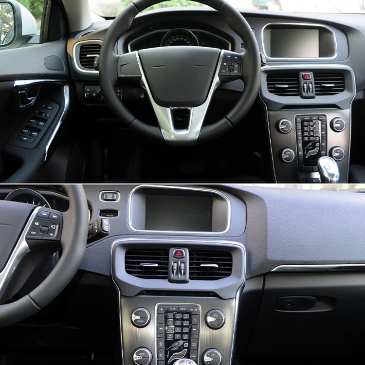 Car dashboard center area with air vent grille and surrounding black trim