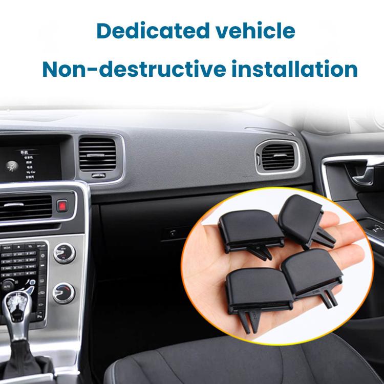 Set of four black air vent paddle inserts held in hand
