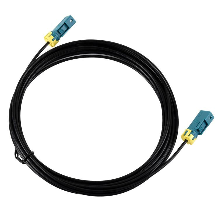 Black coaxial cable with dual Fakra Z female connectors, teal housings and yellow latches.