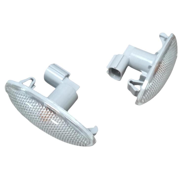 Car turn signal light pair with oval clear textured lenses and gray bulb sockets