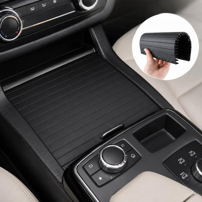 Black ribbed roller shutter cup holder cover, held in hand with sliding panel