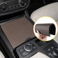 Black ribbed roller cover placed on cup holder area beside beige mat