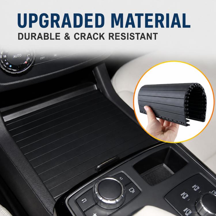 Black ribbed roller shutter cup holder cover in car interior close-up