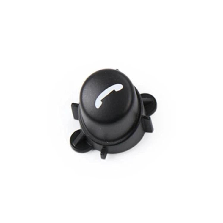Black multifunction steering wheel button with speaker/volume minus icon