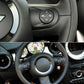 Black multifunction steering wheel buttons installed on the steering wheel spoke
