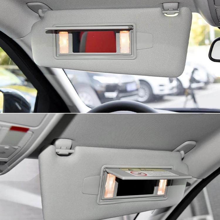 Installed sun visor vanity mirror cover with mirrored opening on gray visor
