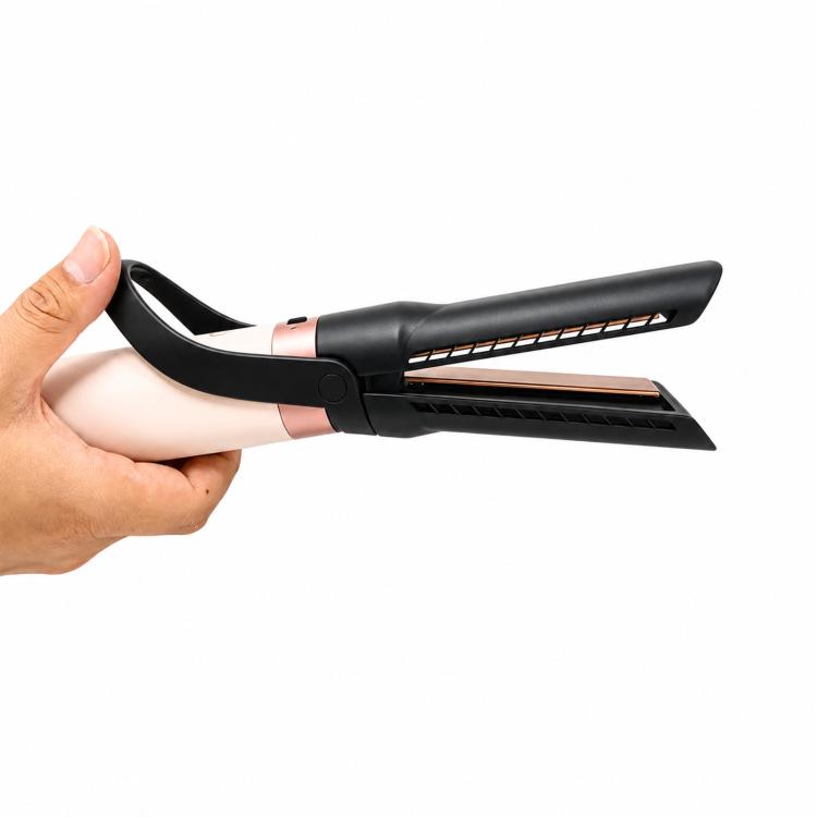 Straightener attachment held in hand, black nozzle with rose-pink center and twin plates