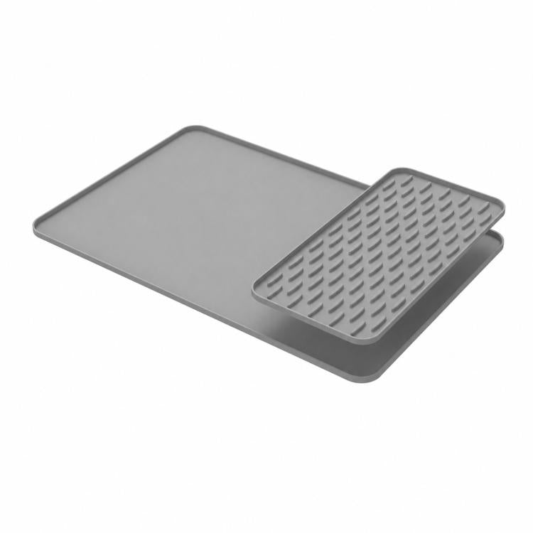Gray silicone countertop draining mat with raised edge and textured removable insert