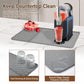 Gray silicone draining mat with textured surface and raised rim to help prevent overflow