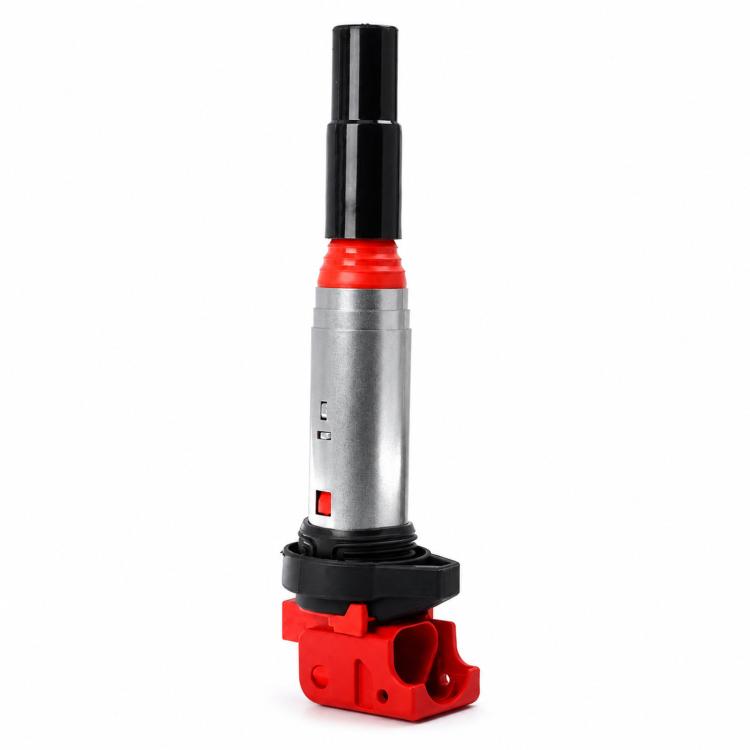 Ignition coil with red electrical connector, gray metal body, black boot and base
